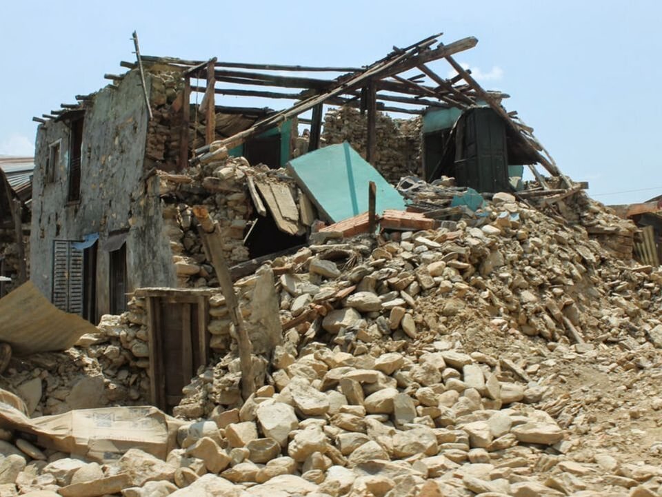 A stone house reduced to rubble by the 2015 Nepal earthquakes