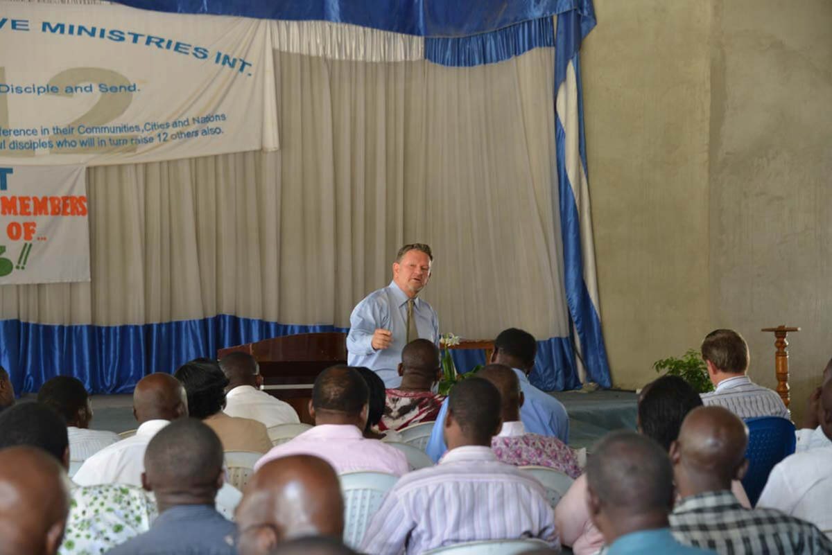 A seminar speaker addressing a seated audience