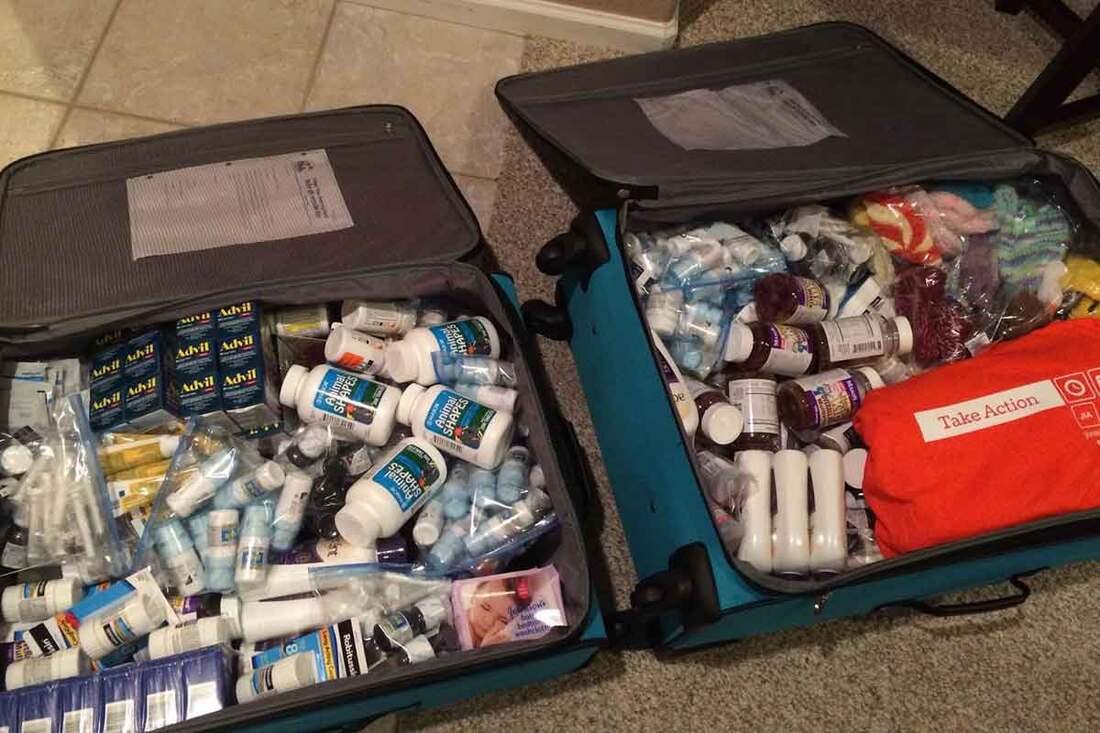 A travel case packed with medicine and supplies